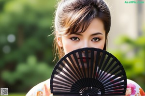A naked asian woman posing for the camera. 