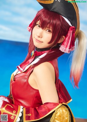 A couple of women dressed in blue and white outfits.