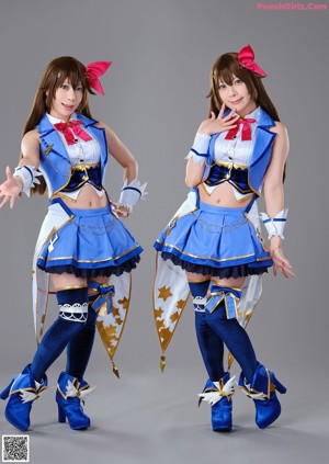 A group of three women dressed in costumes posing for a picture.