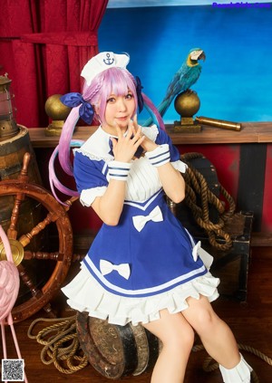A woman in a white and blue outfit posing for a picture.