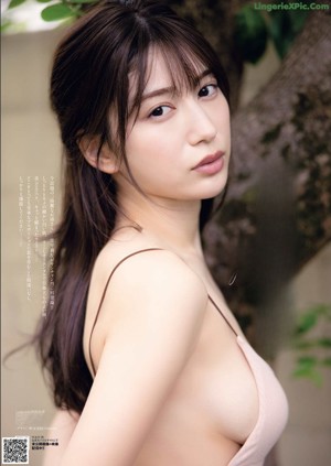 A woman in a black bra and panties on a magazine cover.